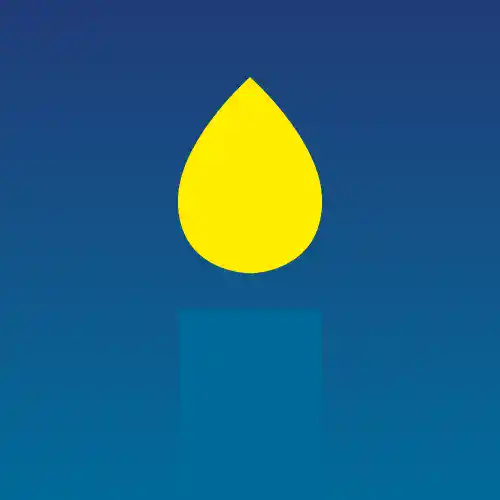 Bougie allumée, symbole de solidarité et d'entraide à Emmaüs Cahors.